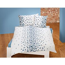 Linge de lit orné d'une belle broderie à motif floral